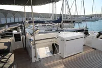 Luxurious 2020 Lagoon 620 yacht interior with modern helm and spacious deck.