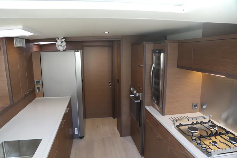  Yacht Photos Pics Luxurious kitchen interior of 2020 Lagoon 620 yacht with modern appliances and sleek design.