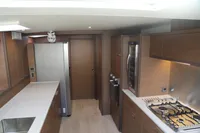 Luxurious kitchen interior of 2020 Lagoon 620 yacht with modern appliances and sleek design.