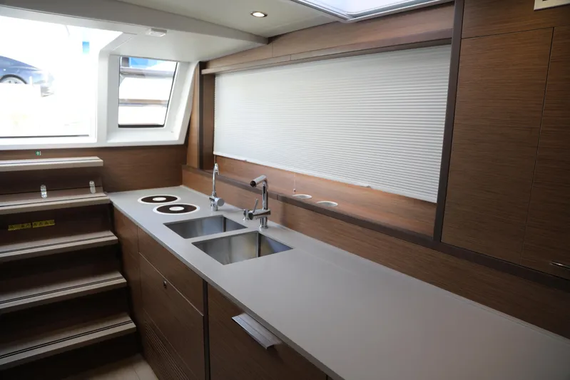  Yacht Photos Pics Modern kitchen interior of 2020 Lagoon 620 yacht with sleek countertops and dual sinks.