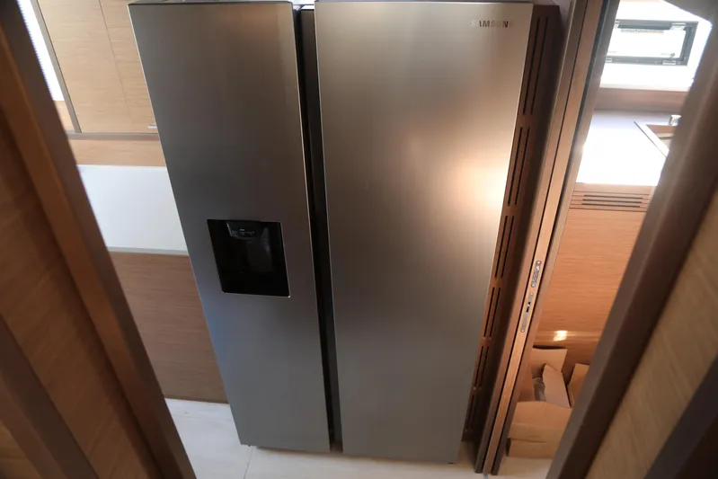  Yacht Photos Pics Stainless steel refrigerator in a 2020 Lagoon 620 yacht interior.