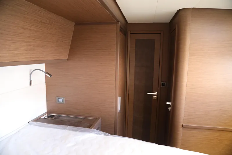  Yacht Photos Pics Interior of 2020 Lagoon 620 yacht cabin with wooden finish and modern design.