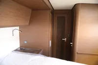 Interior of 2020 Lagoon 620 yacht cabin with wooden finish and modern design.