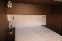 Luxurious cabin interior of 2020 Lagoon 620 yacht with modern wood finish.