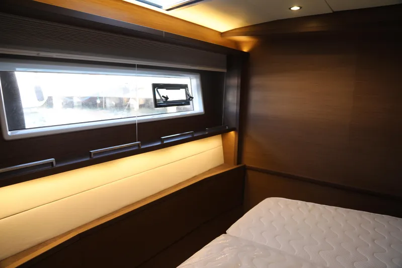  Yacht Photos Pics Luxurious cabin interior of 2020 Lagoon 620 yacht with modern design and ambient lighting.