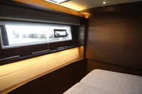 Luxurious cabin interior of 2020 Lagoon 620 yacht with modern design and ambient lighting.