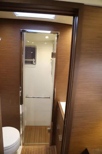 Yacht Photos Pics 2020 Lagoon 620 yacht bathroom with modern design and wooden accents.