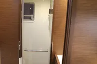 2020 Lagoon 620 yacht bathroom with modern design and wooden accents.