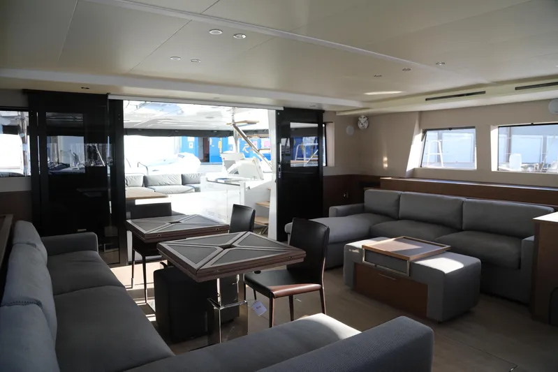  Yacht Photos Pics Luxurious interior of 2020 Lagoon 620 yacht with modern seating and dining area.