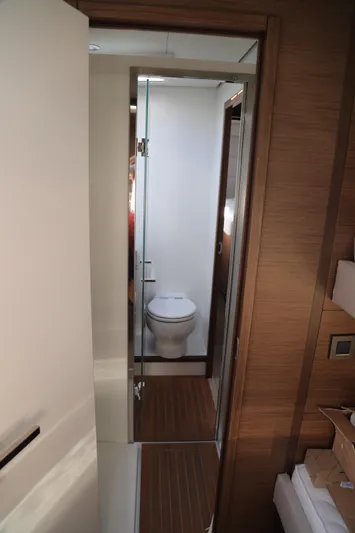  Yacht Photos Pics Interior view of Lagoon 620 yacht bathroom, featuring modern design and wooden accents.