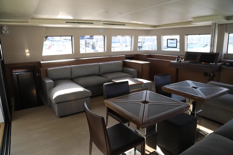  Yacht Photos Pics Luxurious interior of 2020 Lagoon 620 yacht with modern seating and dining area.