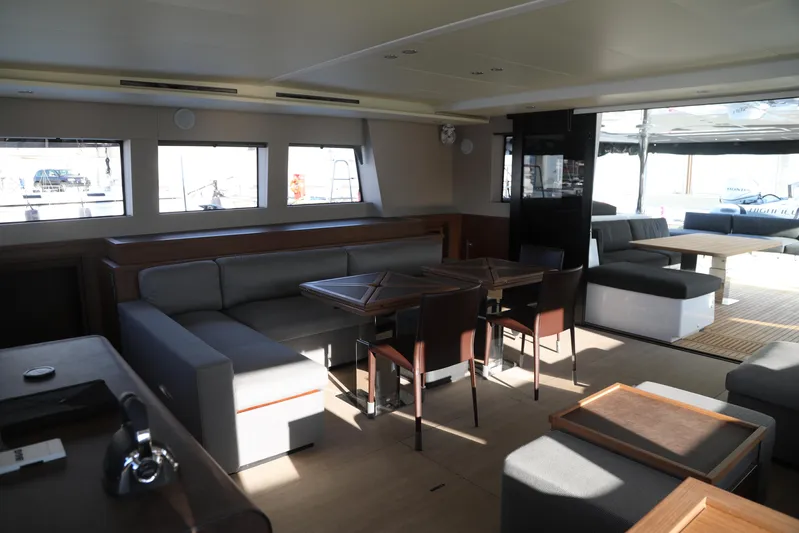  Yacht Photos Pics Luxurious interior of 2020 Lagoon 620 yacht with modern seating and dining area.