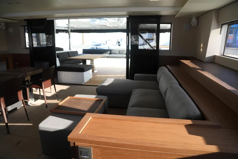  Yacht Photos Pics Luxurious interior of 2020 Lagoon 620 yacht with modern seating and dining area.