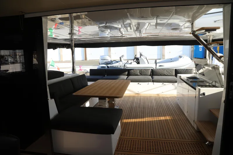  Yacht Photos Pics Luxurious Lagoon 620 yacht interior with seating, table, and modern amenities, 2020 model.