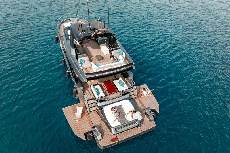 4990 Yacht Photos Pics Luxurious 2024 Riva 82' Diva yacht on serene blue waters, featuring spacious deck and lounging areas.