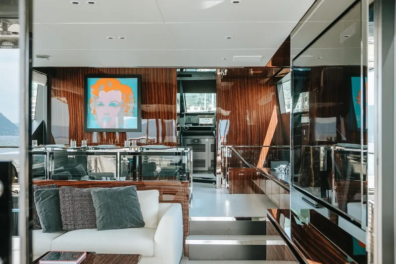 4990 Yacht Photos Pics Luxurious interior of 2024 Riva 82' Diva yacht with modern art and sleek design.