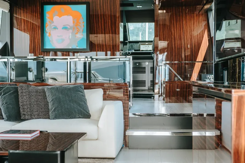 4990 Yacht Photos Pics Luxurious interior of 2024 Riva 82' Diva yacht with modern art and elegant furnishings.
