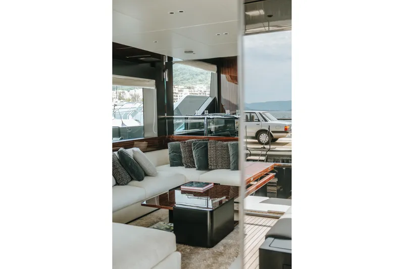 4990 Yacht Photos Pics Luxurious interior of 2024 Riva 82' Diva yacht with elegant seating and scenic view.