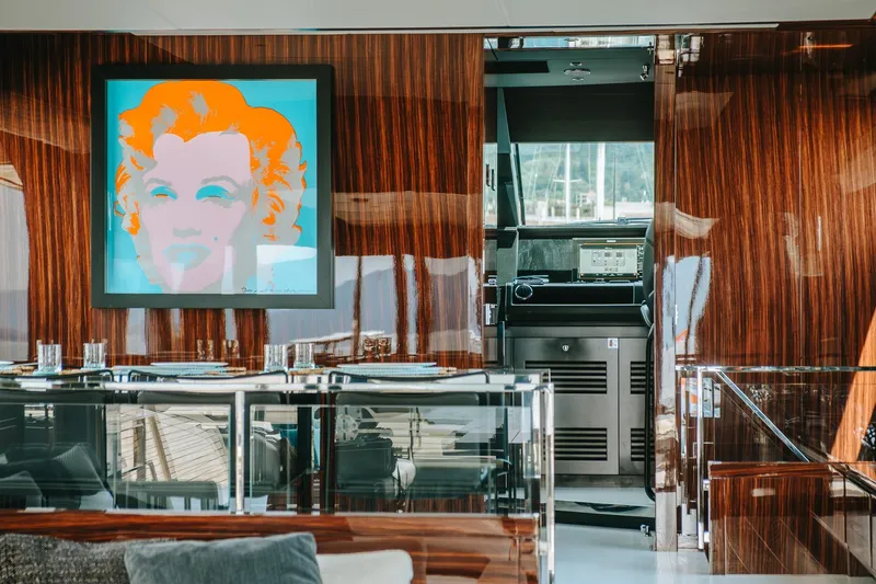 4990 Yacht Photos Pics Luxurious interior of 2024 Riva 82' Diva yacht with modern art and elegant wood finish.