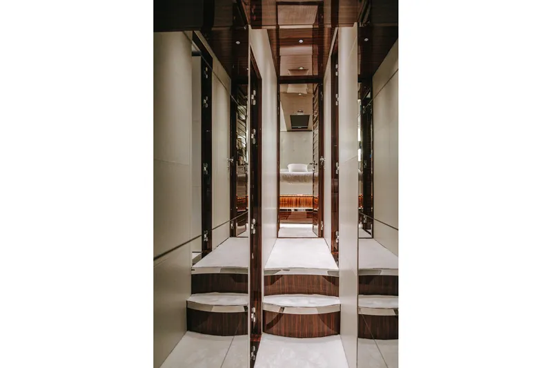 4990 Yacht Photos Pics Luxurious interior of 2024 Riva 82' Diva yacht, featuring elegant hallway and bedroom.