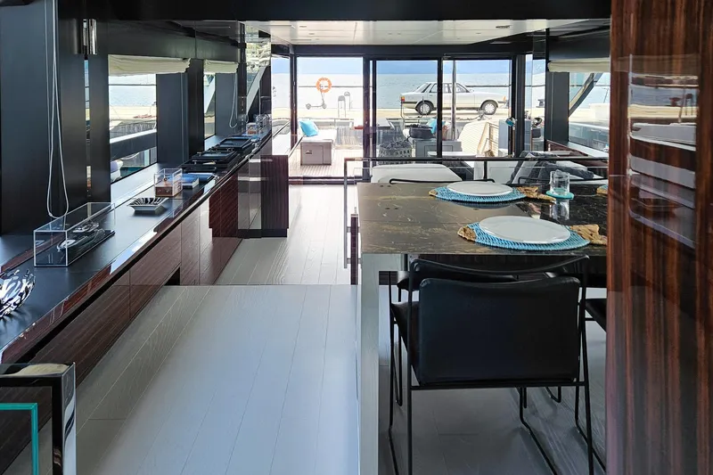 4990 Yacht Photos Pics Luxurious interior of 2024 Riva 82' Diva yacht with elegant dining area.