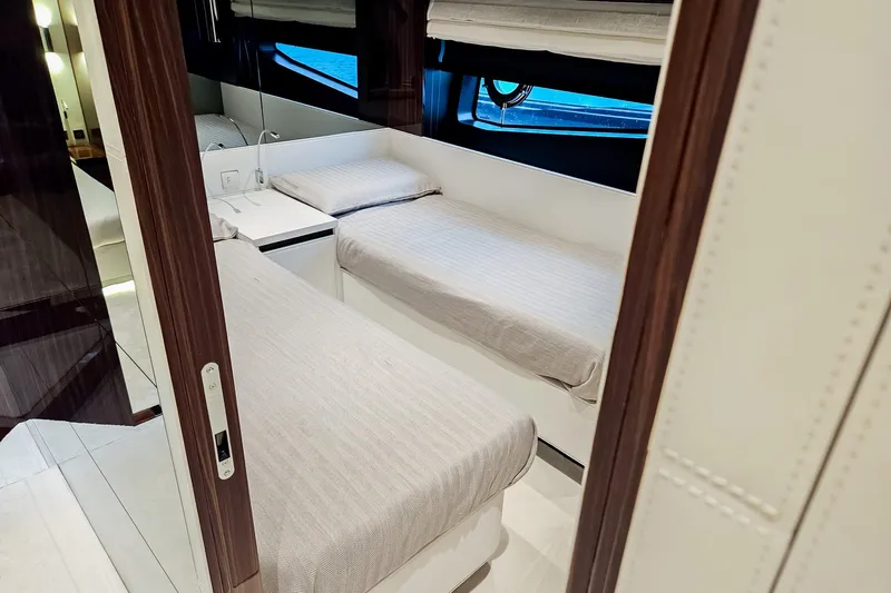4990 Yacht Photos Pics Luxurious cabin interior of 2024 Riva 82' Diva yacht with twin beds.