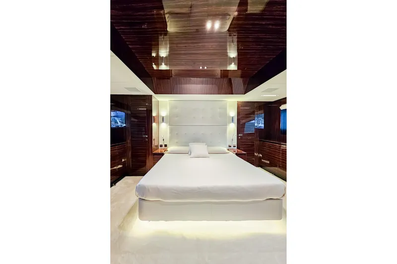 4990 Yacht Photos Pics Luxurious bedroom interior of 2024 Riva 82' Diva yacht with modern design elements.