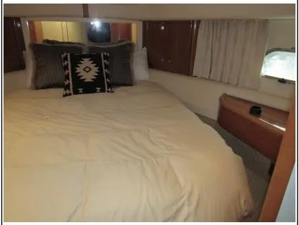 My Girls Too Yacht Photos Pics Cozy bedroom in 1998 Viking Princess 460 Sport Cruiser Flybridge yacht with decorative pillows.