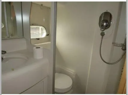 My Girls Too Yacht Photos Pics Bathroom interior of 1998 Viking Princess 460 Sport Cruiser Flybridge yacht, featuring shower and toilet.