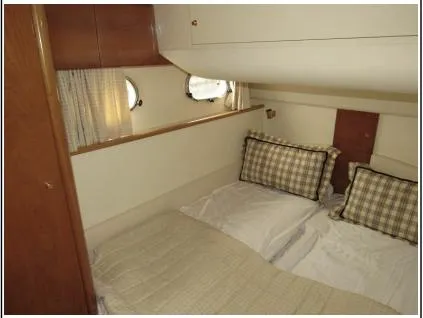 My Girls Too Yacht Photos Pics Cozy cabin interior of 1998 Viking Princess 460 Sport Cruiser Flybridge with twin beds.