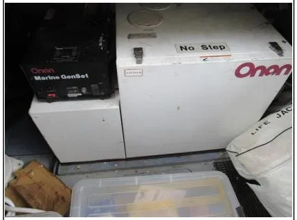 My Girls Too Yacht Photos Pics Onan Marine GenSet in Viking Princess 460 Sport Cruiser, 1998 model, with storage items nearby.