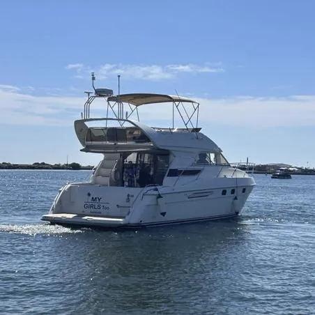 My Girls Too Yacht Photos Pics 1998 Viking Princess 460 Sport Cruiser Flybridge yacht on calm waters.