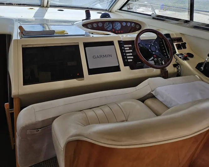 My Girls Too Yacht Photos Pics 1998 Viking Princess 460 Sport Cruiser Flybridge helm with Garmin navigation system.