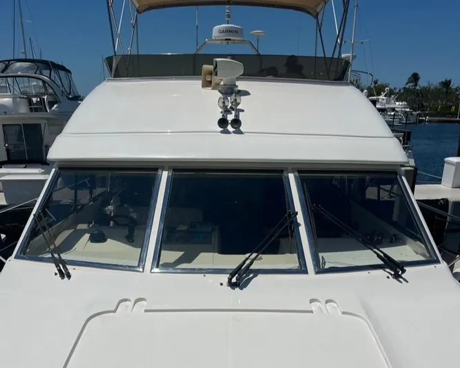 My Girls Too Yacht Photos Pics 1998 Viking Princess 460 Sport Cruiser Flybridge docked at marina.