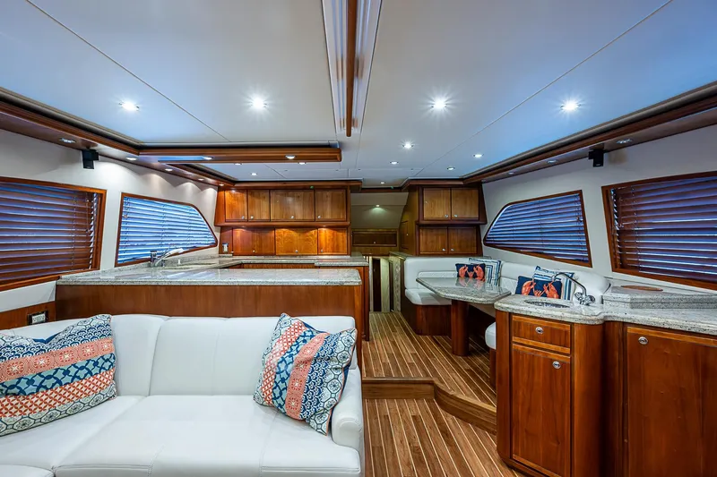  Yacht Photos Pics Luxurious interior of 2006 Bertram 630 Convertible yacht with wood finishes and modern amenities.