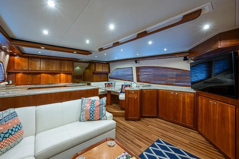  Yacht Photos Pics Luxurious interior of a 2006 Bertram 630 Convertible yacht with elegant wood finishes.