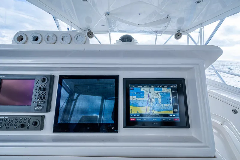  Yacht Photos Pics Control panel of a 2006 Bertram 630 Convertible yacht with navigation screens.