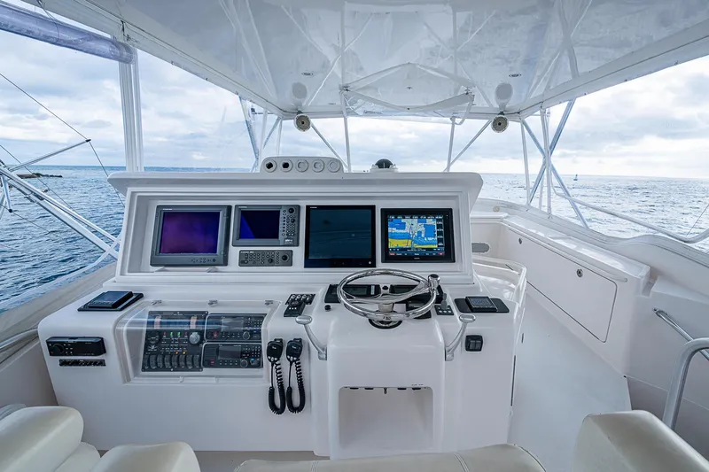  Yacht Photos Pics Helm of 2006 Bertram 630 Convertible yacht with advanced navigation systems and ocean view.