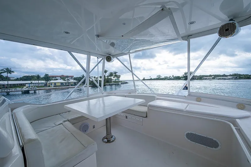  Yacht Photos Pics Luxurious 2006 Bertram 630 Convertible yacht interior with ocean view and seating area.