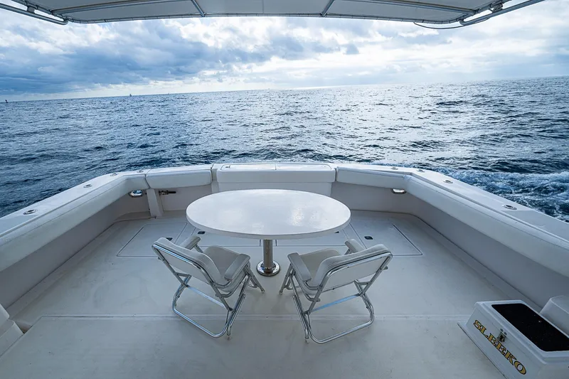  Yacht Photos Pics Bertram 630 Convertible 2006 yacht deck with ocean view and seating area.