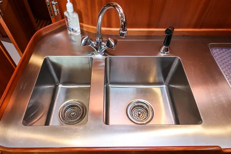 Chic Yacht Photos Pics Stainless steel double sink on 2003 Hinckley Talaria 44 Express yacht.