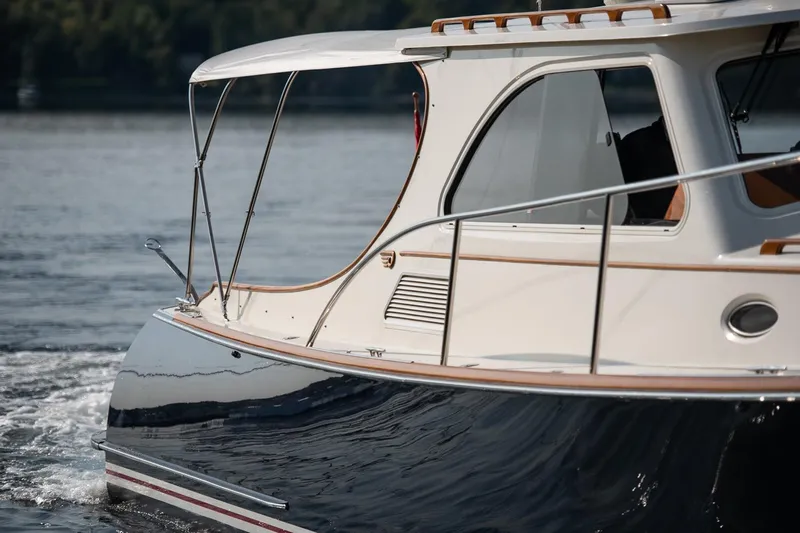 Chic Yacht Photos Pics 2003 Hinckley Talaria 44 Express yacht cruising on calm waters.