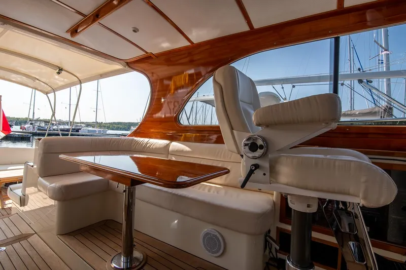 Chic Yacht Photos Pics Luxurious interior of 2003 Hinckley Talaria 44 Express yacht with elegant seating and wooden accents.