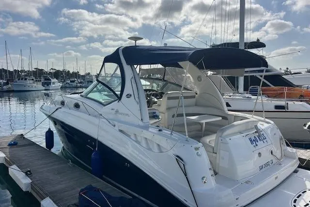 H20 Kiss Yacht Photos Pics 2005 Searay 320 yacht docked at marina under cloudy sky.