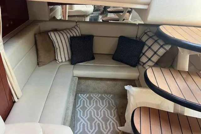 H20 Kiss Yacht Photos Pics Interior of 2005 Searay 320 boat with cozy seating and decorative pillows.