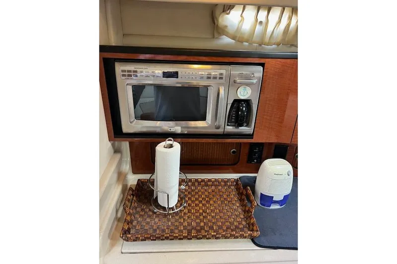 H20 Kiss Yacht Photos Pics 2005 Searay 320 yacht kitchen with microwave, coffee maker, and paper towel holder.