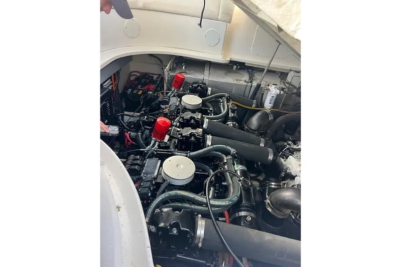 H20 Kiss Yacht Photos Pics Engine compartment of a 2005 Searay 320 boat, showcasing mechanical components and wiring.