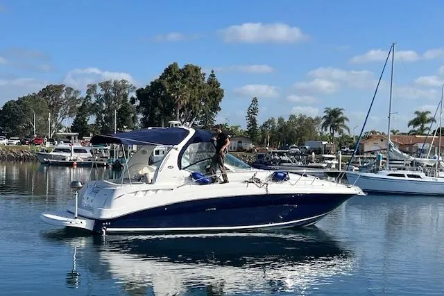 H20 Kiss Yacht Photos Pics 2005 Searay 320 boat cruising in a marina under a clear blue sky.