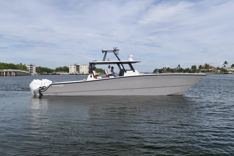  Yacht Photos Pics 2022 Freeman 42LR boat cruising on calm waters under a clear sky.