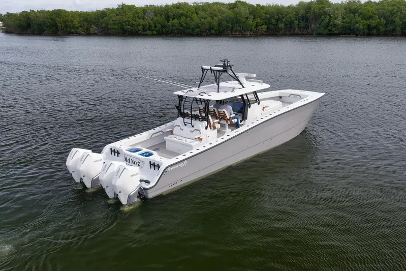  Yacht Photos Pics 2022 Freeman 42LR boat with quad engines on calm water.